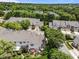 An aerial view of the homes, landscaping, and community in a tranquil wooded setting at 12221 Orchardgrass Ln, Raleigh, NC 27614