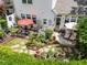 Relaxing backyard space complete with patio furniture, potted plants, and a private garden area at 12221 Orchardgrass Ln, Raleigh, NC 27614