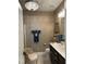 Cozy bathroom featuring a single vanity, chair and tiled floors at 12221 Orchardgrass Ln, Raleigh, NC 27614