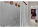 Bathroom featuring all white design with tub and shower, and access to adjacent room at 12221 Orchardgrass Ln, Raleigh, NC 27614