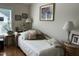 Comfortable bedroom with a chaise lounge and plenty of natural light at 12221 Orchardgrass Ln, Raleigh, NC 27614
