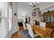 Bright dining room with hardwood floors, a chandelier, and an adjacent living room at 12221 Orchardgrass Ln, Raleigh, NC 27614