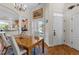 Cozy dining area with natural light, seamlessly connected to the modern kitchen with granite counters at 12221 Orchardgrass Ln, Raleigh, NC 27614