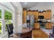The kitchen features lots of natural light and ample kitchen storage at 12221 Orchardgrass Ln, Raleigh, NC 27614