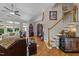 Spacious living room with hardwood floors, staircase and plenty of natural light at 12221 Orchardgrass Ln, Raleigh, NC 27614
