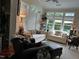 Bright living room with large windows and comfortable seating at 12221 Orchardgrass Ln, Raleigh, NC 27614