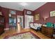 Living room featuring hardwood floors, accent walls and classic decor at 12221 Orchardgrass Ln, Raleigh, NC 27614
