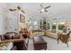 Bright and airy living room featuring large windows and comfortable seating at 12221 Orchardgrass Ln, Raleigh, NC 27614