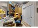 Office with built in shelving, hardwood floors, and closet at 12221 Orchardgrass Ln, Raleigh, NC 27614