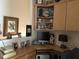 Well-lit home office featuring built-in cabinetry, desk space, and organized shelves at 12221 Orchardgrass Ln, Raleigh, NC 27614