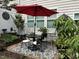 Charming patio area with outdoor dining set, ideal for entertaining and enjoying the outdoors at 12221 Orchardgrass Ln, Raleigh, NC 27614