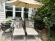 Relaxing outdoor lounge area featuring comfortable chaise lounges and decorative pillows at 12221 Orchardgrass Ln, Raleigh, NC 27614