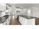 Modern kitchen with white cabinets, stainless steel appliances, and a center island with seating at 123 Pony Gallop Ln, Clayton, NC 27520