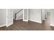Spacious living room with hardwood floors, French doors, and an open floor plan at 123 Pony Gallop Ln, Clayton, NC 27520