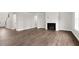Spacious living room with hardwood floors, a fireplace, and an open layout at 123 Pony Gallop Ln, Clayton, NC 27520
