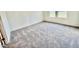 A comfortable room features neutral carpeting and plenty of natural light at 124 N Keatts Winner Ct, Wilson's Mills, NC 27520