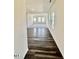 Stylish foyer with dark wood-look flooring leading into the bright, open living area with abundant natural light at 124 N Keatts Winner Ct, Wilson's Mills, NC 27520