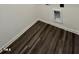 This room has brown laminate flooring and white trim along the walls at 124 N Keatts Winner Ct, Wilson's Mills, NC 27520