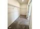 A neutral carpeted walk-in closet features wire shelving and a door at 124 N Keatts Winner Ct, Wilson's Mills, NC 27520