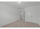 A bedroom with a double door closet and neutral carpeting throughout at 127 Bowerbank Ln, Apex, NC 27539