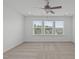 A bedroom with lots of windows providing natural light and neutral carpeting throughout at 127 Bowerbank Ln, Apex, NC 27539
