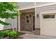 Close-up of the brick and siding entrance to the light-colored townhouse at 127 Bowerbank Ln, Apex, NC 27539