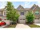 Charming townhouse with attached garage and well-maintained landscaping at 127 Bowerbank Ln, Apex, NC 27539