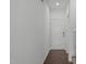 Bright, freshly-painted foyer with wood floors and white door at 127 Bowerbank Ln, Apex, NC 27539