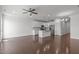 Spacious living room featuring hardwood floors and a ceiling fan at 127 Bowerbank Ln, Apex, NC 27539