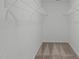 A walk-in closet featuring carpeted flooring and white wire shelving at 127 Bowerbank Ln, Apex, NC 27539
