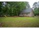The spacious backyard has a swing set and play equipment, perfect for outdoor fun and relaxation at 129 Clark Ct, Youngsville, NC 27596