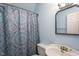 Bathroom featuring a claw foot style sink, shower with patterned curtain, and light blue walls at 129 Clark Ct, Youngsville, NC 27596