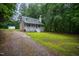 This exterior features a porch with a white banister and a gravel driveway at 129 Clark Ct, Youngsville, NC 27596