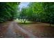 The long driveway leads to a charming home at 129 Clark Ct, Youngsville, NC 27596