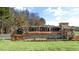 Beautiful stone and wood sign that reads 'Swift Creek Farm', situated in a well-manicured landscape at 135 Pony Gallop Ln, Clayton, NC 27520