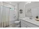 Bright bathroom features a shower/tub combo and a sink with a modern countertop at 159 Clear Water Rd, Louisburg, NC 27549