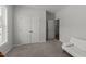 Neutral bedroom with carpet, features a large closet with double doors, and a white couch at 159 Clear Water Rd, Louisburg, NC 27549