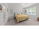 Comfortable bedroom with soft carpet, neutral walls, and a well-lit window at 159 Clear Water Rd, Louisburg, NC 27549