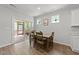 Light-filled dining area with sliding doors to the outdoor deck, perfect for entertaining at 159 Clear Water Rd, Louisburg, NC 27549