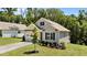 Beautiful single-Gathering home with a well-maintained lawn, mature landscaping, and an attached two-car garage at 159 Clear Water Rd, Louisburg, NC 27549