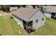 Aerial view of a charming single-Gathering home with a well-kept lawn and a screened porch at 159 Clear Water Rd, Louisburg, NC 27549