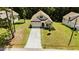 Beautiful two-story home with a large front yard, long driveway, and well-maintained landscaping from an aerial view at 159 Clear Water Rd, Louisburg, NC 27549