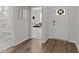 Foyer view showcasing hardwood floors, a white door, and hallway access to a bathroom and a room at 159 Clear Water Rd, Louisburg, NC 27549