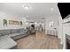 Open-concept living space with a fireplace, couch, and seamless flow to the kitchen at 159 Clear Water Rd, Louisburg, NC 27549