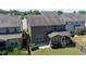 Aerial view showcasing the backyard, patio, screened porch, and neighboring homes in a quiet community at 1600 Drift Falls Ln, Wendell, NC 27591