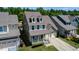 Aerial view of a house showcasing its architecture, landscaping, and surrounding neighborhood at 1600 Drift Falls Ln, Wendell, NC 27591
