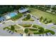 Aerial view of community amenities including a pool, outdoor structure and green spaces at 1600 Drift Falls Ln, Wendell, NC 27591