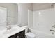 Bathroom with white tub and shower combination, offering functionality and style at 1600 Drift Falls Ln, Wendell, NC 27591