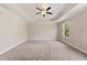 Expansive bedroom featuring tray ceiling, recessed lights, and carpeted floors at 1600 Drift Falls Ln, Wendell, NC 27591