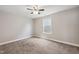 Well-lit bedroom with a ceiling fan, neutral paint, and carpet flooring at 1600 Drift Falls Ln, Wendell, NC 27591